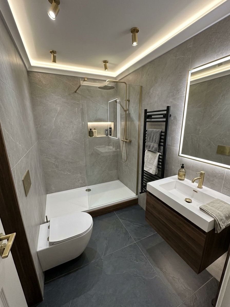 Clean lines. Warm lighting. Luxury finish.Another bathroom transformed into a modern, spa-like s